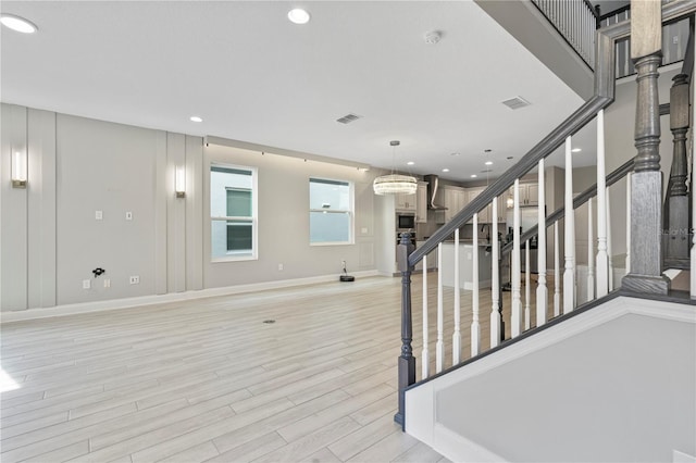 stairway featuring wood-type flooring