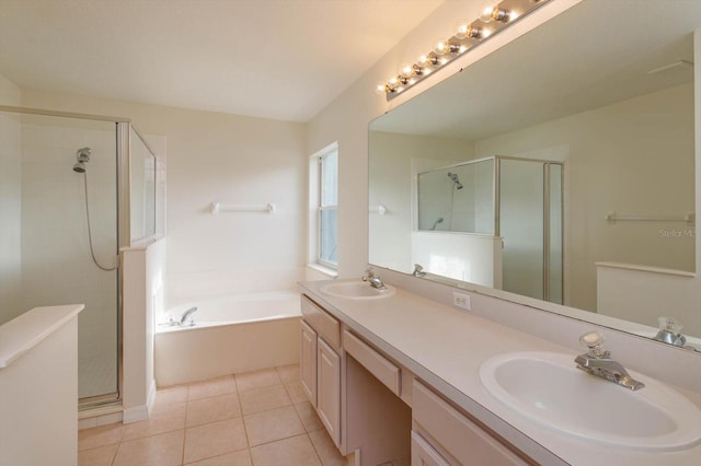 bathroom featuring independent shower and bath, tile patterned floors, and vanity