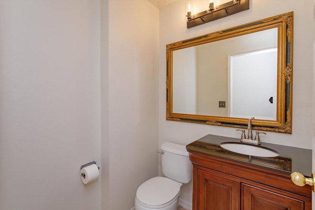 bathroom with toilet and vanity