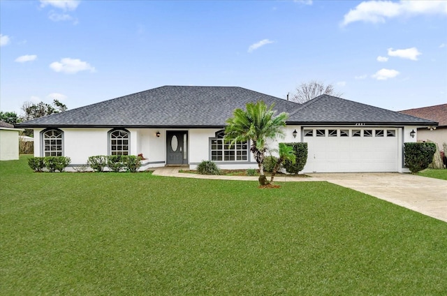 ranch-style home featuring a garage and a front yard