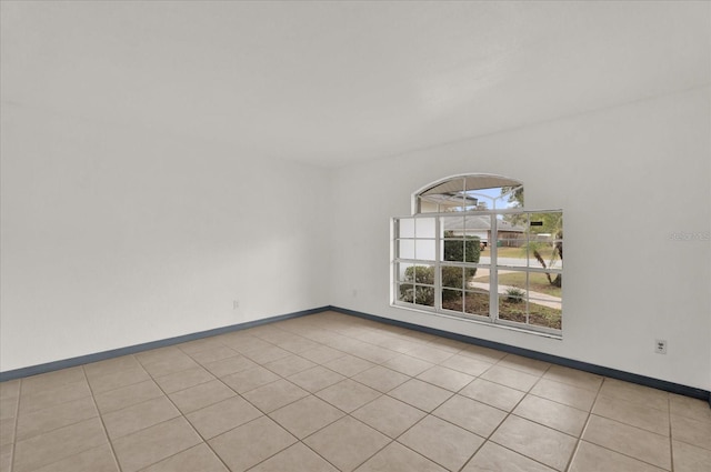 unfurnished room featuring light tile patterned flooring