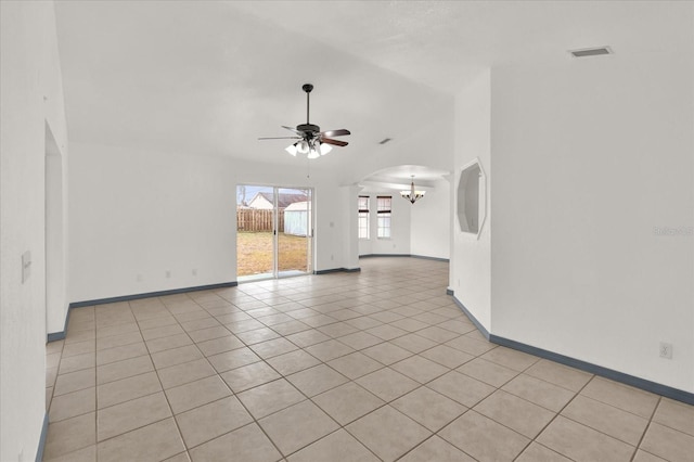 unfurnished living room featuring ceiling fan with notable chandelier and light tile patterned floors