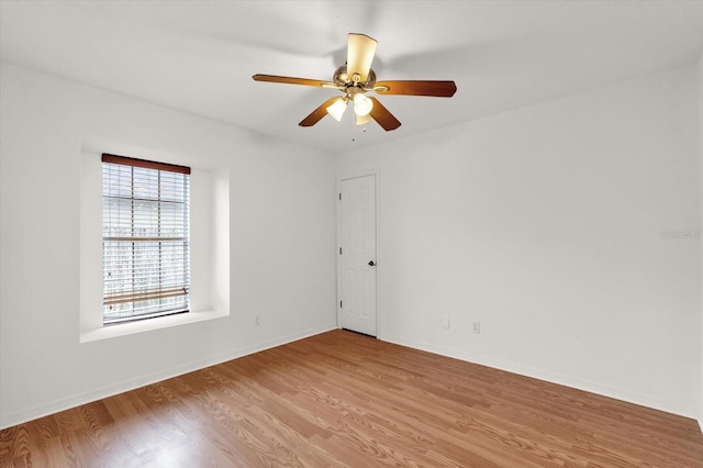 spare room with ceiling fan and light hardwood / wood-style flooring