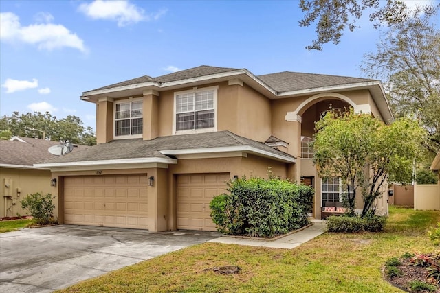 view of front of house featuring a garage and a front yard