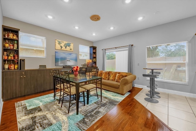 dining space with light hardwood / wood-style floors