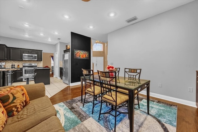 dining area with light wood-type flooring