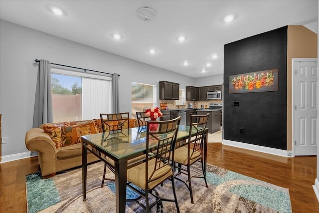 dining area with hardwood / wood-style flooring