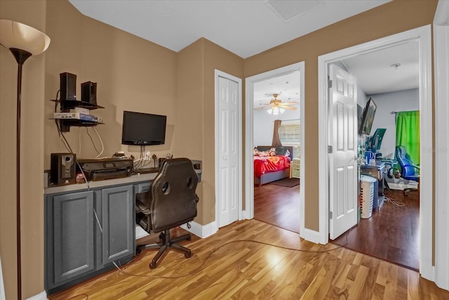 office with light wood-type flooring