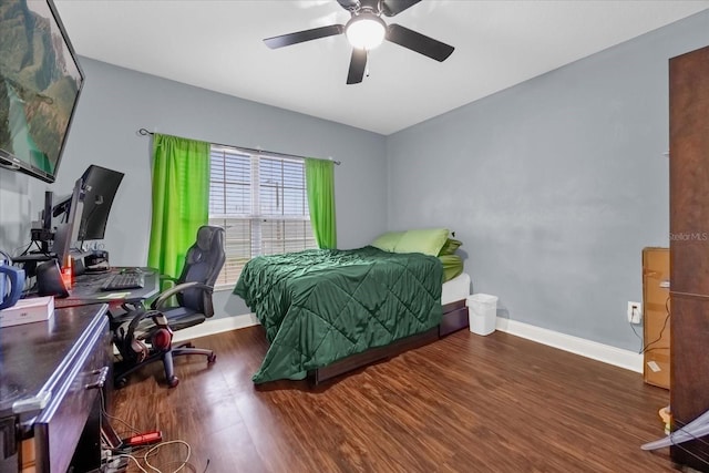 bedroom with ceiling fan and dark hardwood / wood-style flooring