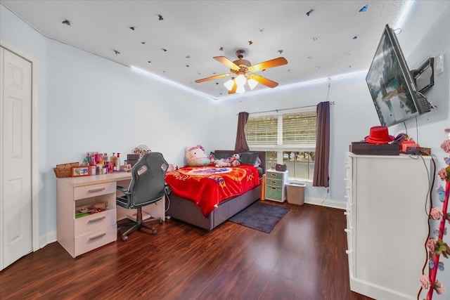 bedroom featuring dark hardwood / wood-style flooring and ceiling fan