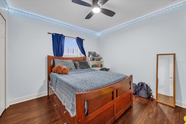 bedroom with ceiling fan and dark hardwood / wood-style floors