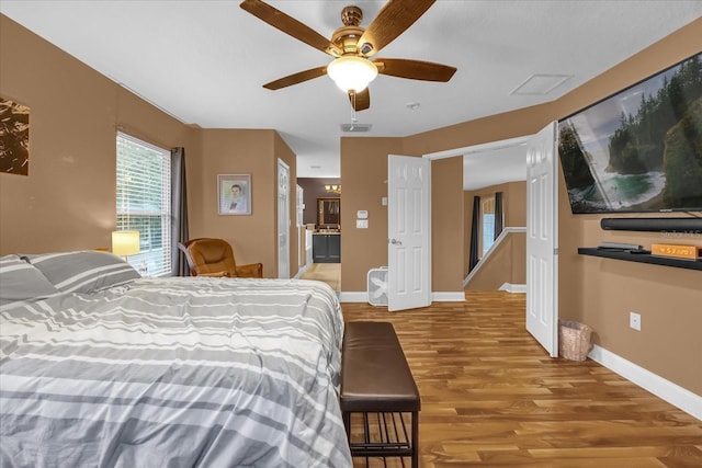 bedroom featuring ceiling fan and light hardwood / wood-style flooring