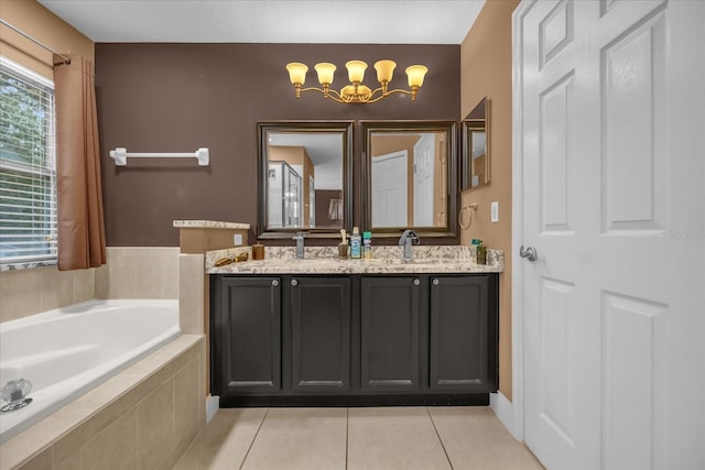 bathroom featuring a relaxing tiled tub, vanity, and tile patterned flooring