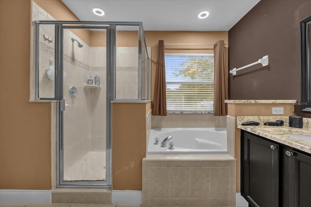 bathroom with vanity and plus walk in shower