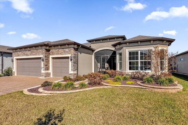 view of front of home with a garage and a front yard