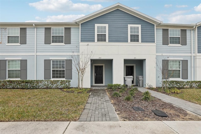 view of property featuring a front yard