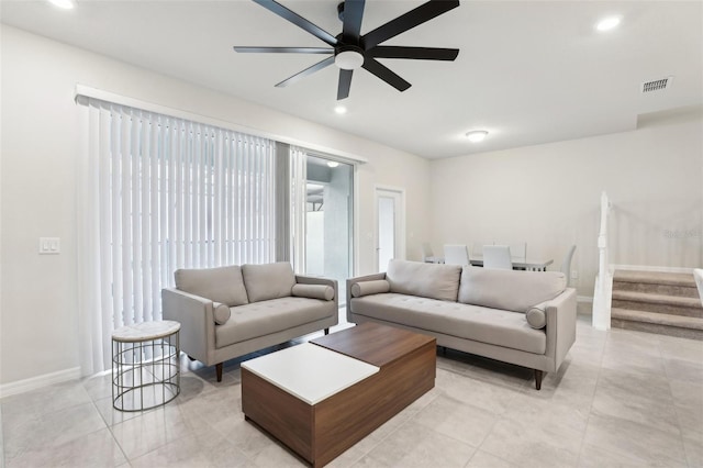 living room with light tile patterned floors and ceiling fan