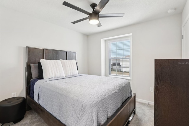 bedroom featuring ceiling fan and carpet flooring