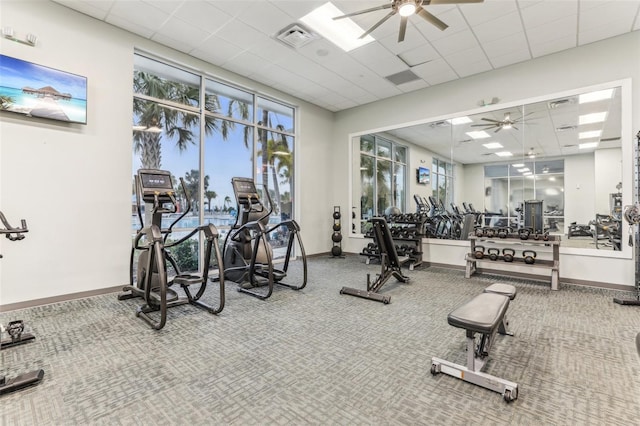 workout area featuring a paneled ceiling and ceiling fan