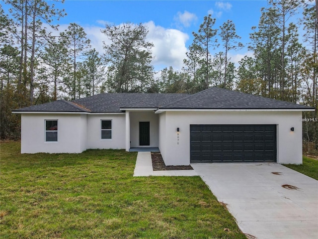 ranch-style home with a garage and a front lawn