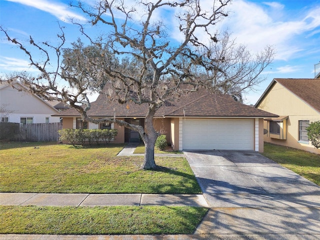 view of front facade with a front yard and a garage