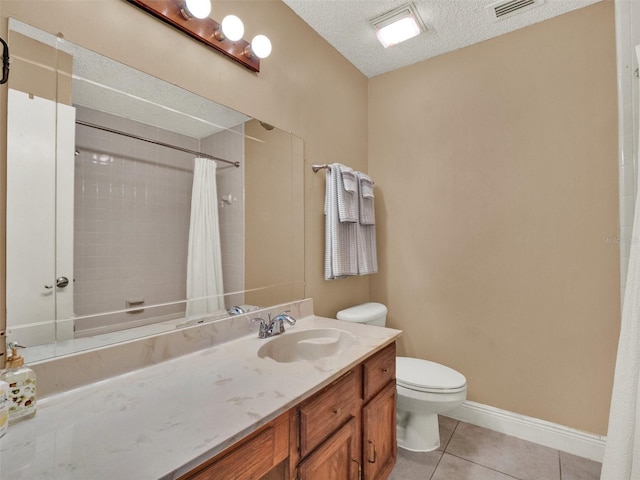 bathroom with a textured ceiling, tile patterned flooring, vanity, a shower with curtain, and toilet