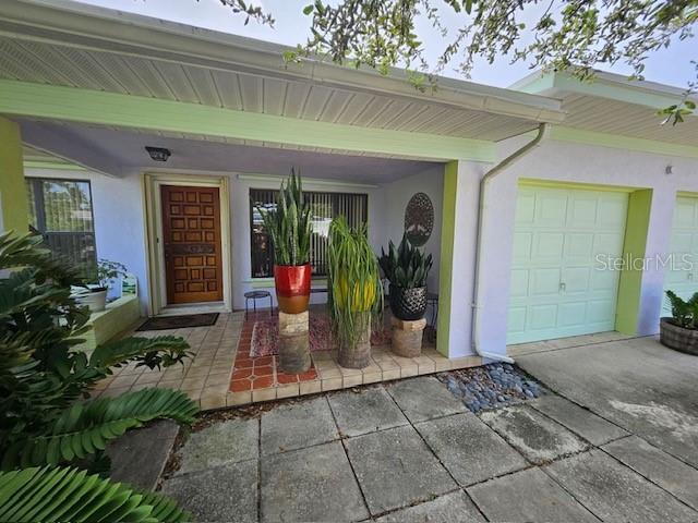 property entrance with a garage