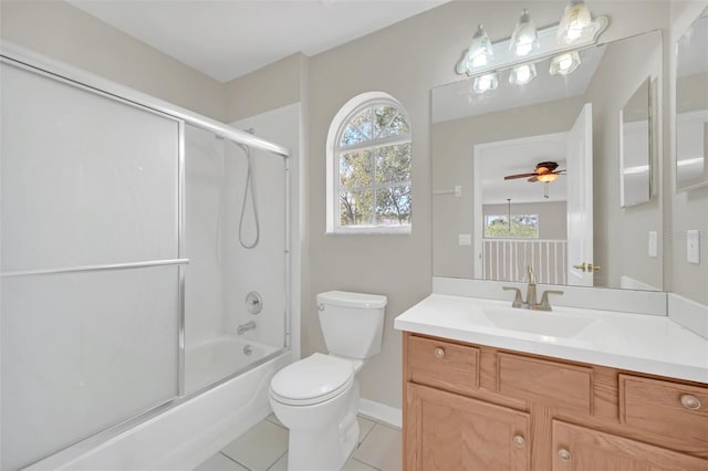 full bathroom with tile patterned floors, vanity, toilet, ceiling fan, and combined bath / shower with glass door