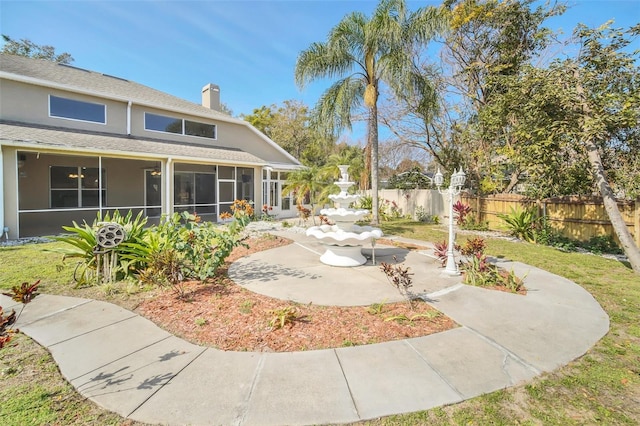 view of yard featuring a sunroom