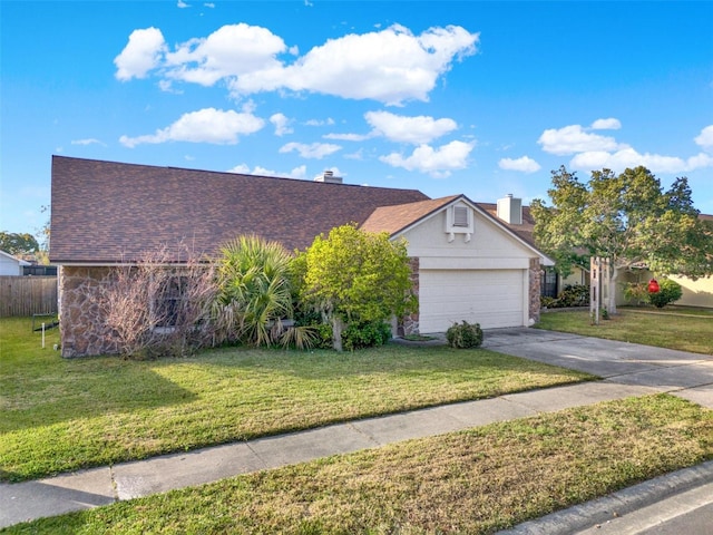 view of front of home with a garage and a front yard