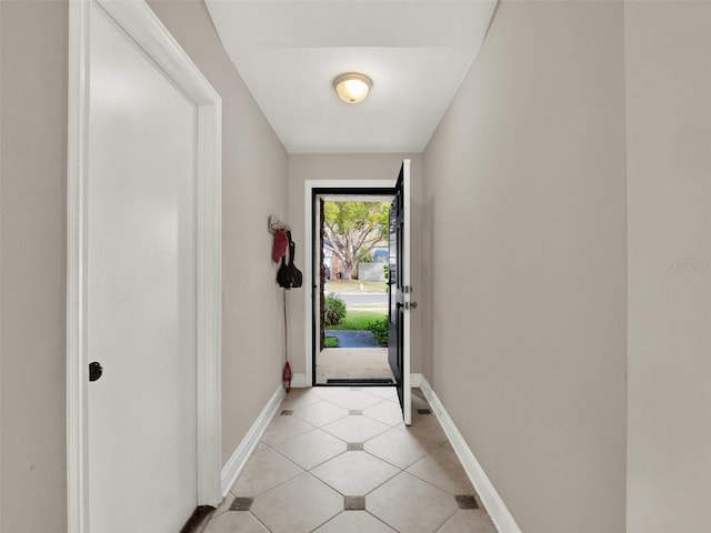 doorway featuring light tile patterned floors