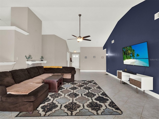 tiled living room with high vaulted ceiling and ceiling fan