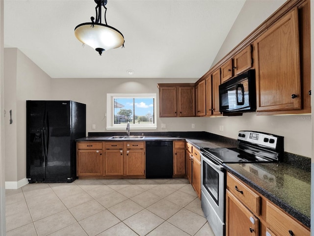 kitchen with decorative light fixtures, lofted ceiling, black appliances, sink, and light tile patterned floors