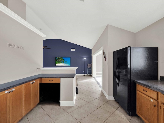 kitchen with light tile patterned flooring, black refrigerator with ice dispenser, kitchen peninsula, vaulted ceiling, and ceiling fan