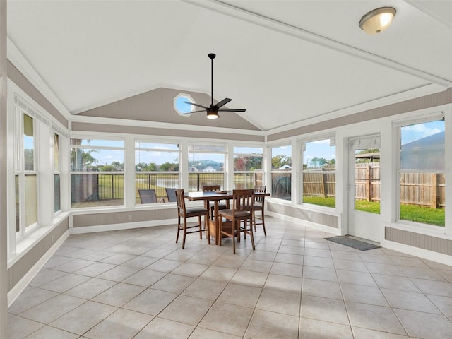 sunroom featuring ceiling fan and vaulted ceiling