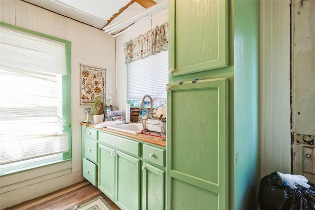 bathroom featuring a healthy amount of sunlight, hardwood / wood-style flooring, and vanity