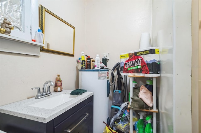 laundry area with water heater and sink