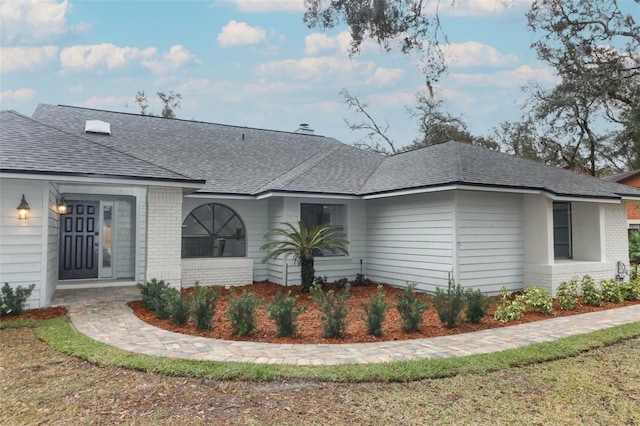 back of house featuring a yard