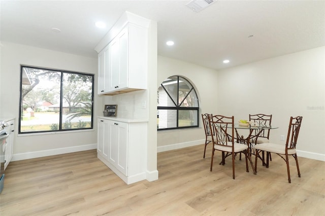 dining room with light hardwood / wood-style flooring