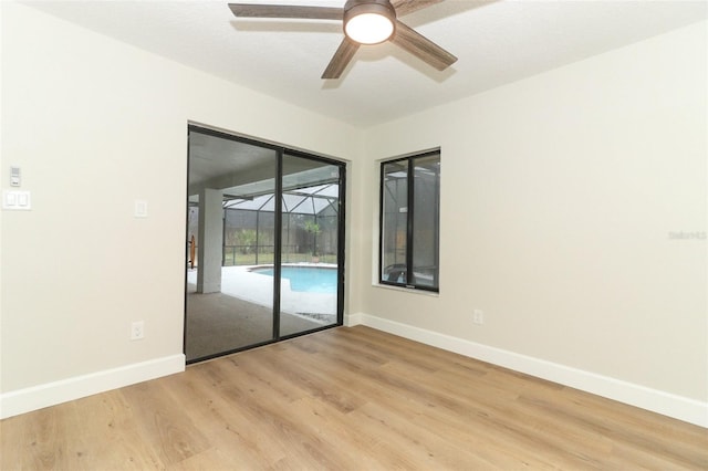 unfurnished room with ceiling fan and light hardwood / wood-style flooring