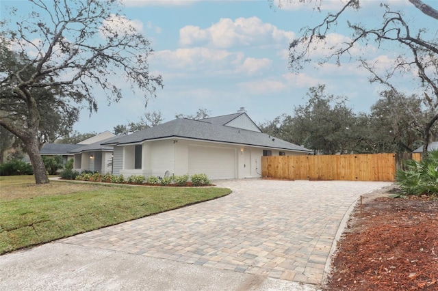 view of side of property with a garage and a yard