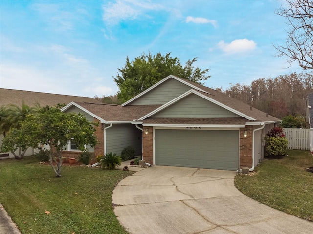 view of front of home with a garage and a front yard