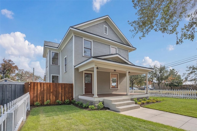 view of front facade with covered porch and a front lawn