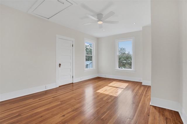 unfurnished room with hardwood / wood-style floors and ceiling fan