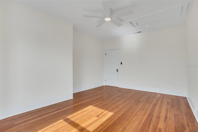 spare room featuring hardwood / wood-style flooring and ceiling fan