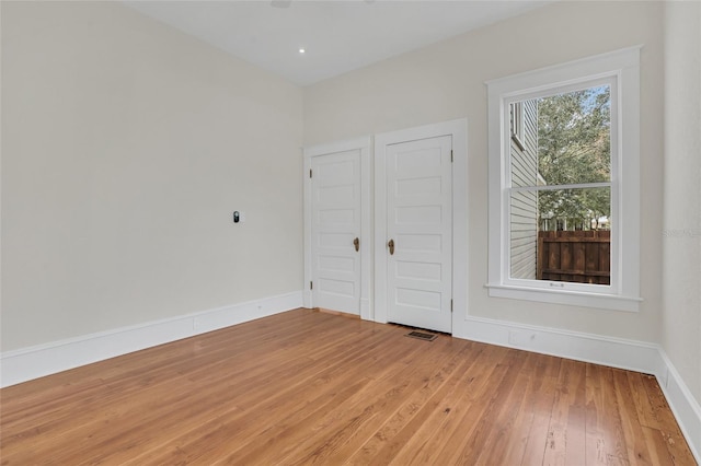 unfurnished bedroom featuring wood-type flooring