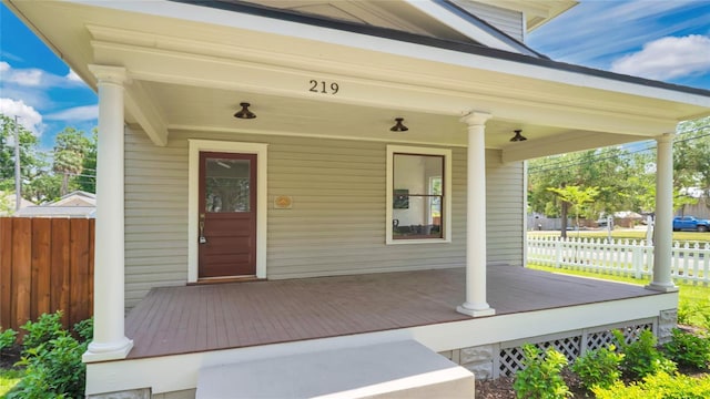 219 Laurel Ave, Sanford, FL 32771 - doorway to property featuring covered porch and fence