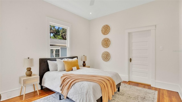 219 Laurel Ave, Sanford, FL 32771 - bedroom with wood finished floors, baseboards, and a ceiling fan