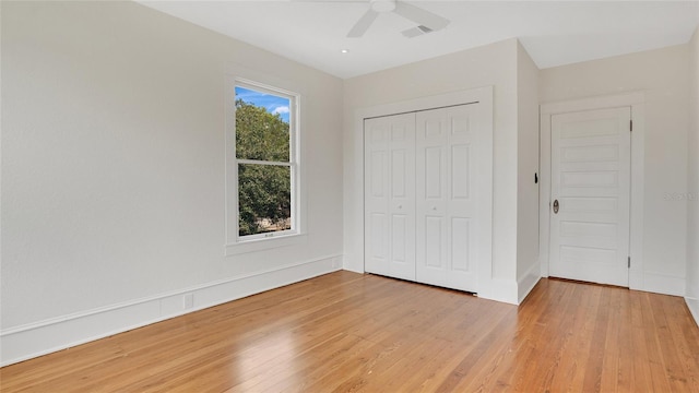 219 Laurel Ave, Sanford, FL 32771 - unfurnished bedroom featuring light wood-style flooring, a closet, a ceiling fan, and baseboards