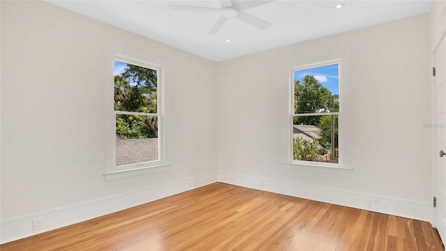 219 Laurel Ave, Sanford, FL 32771 - empty room with healthy amount of natural light, light wood finished floors, ceiling fan, and baseboards